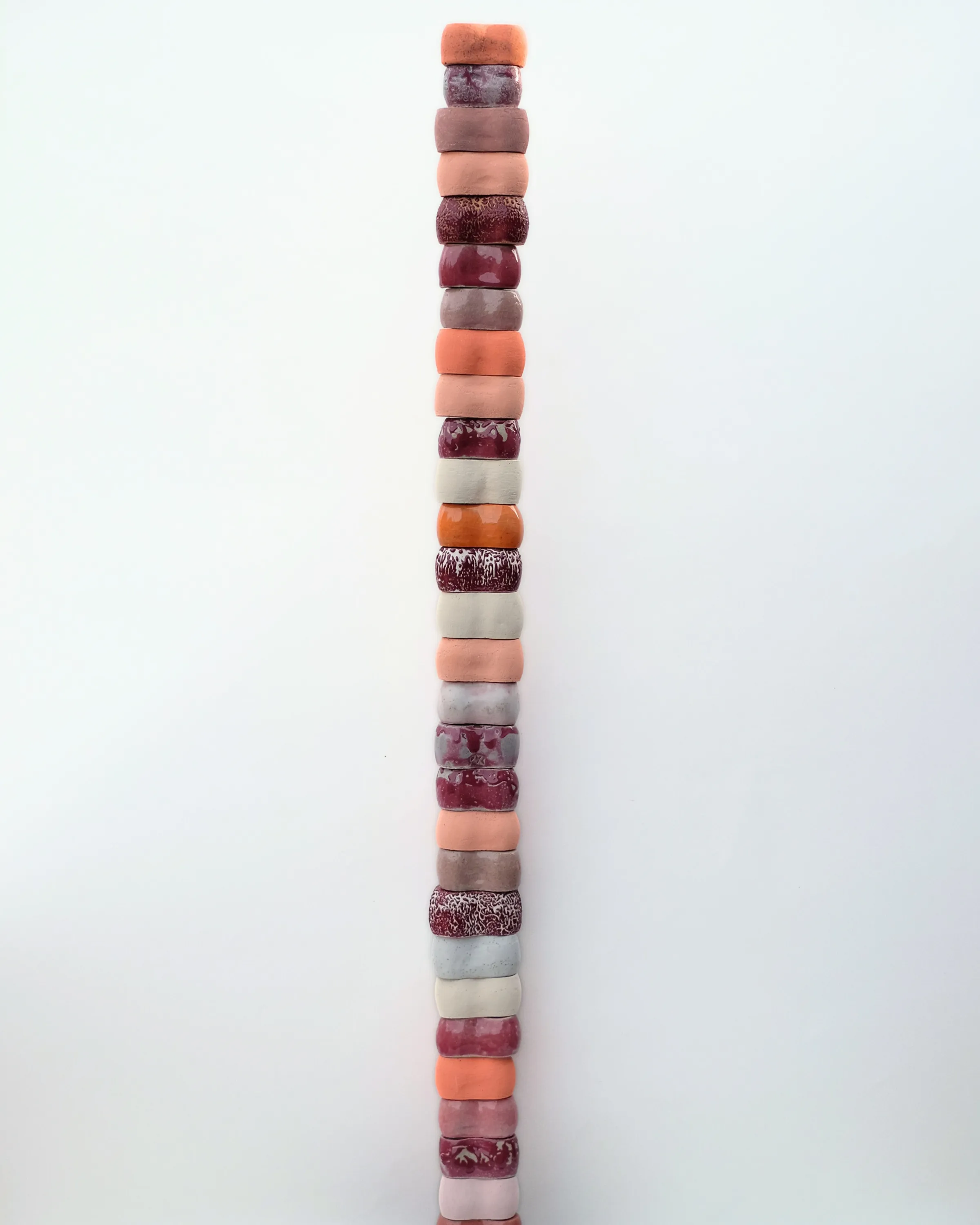 Knuckle Totem (Multi Masala) by Minaal Lawn, a tall stack of glazed ceramic forms
